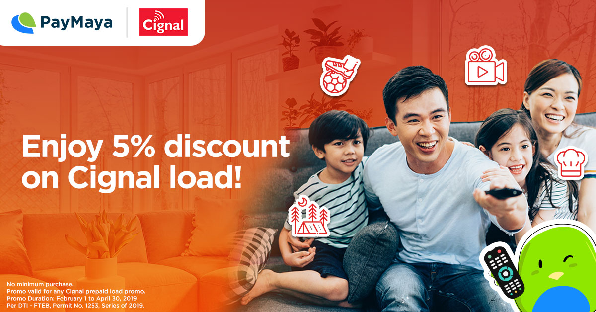 A family inside house sitting on a couch while watching on a Television with Maya Bird facing in front holding a remote controller